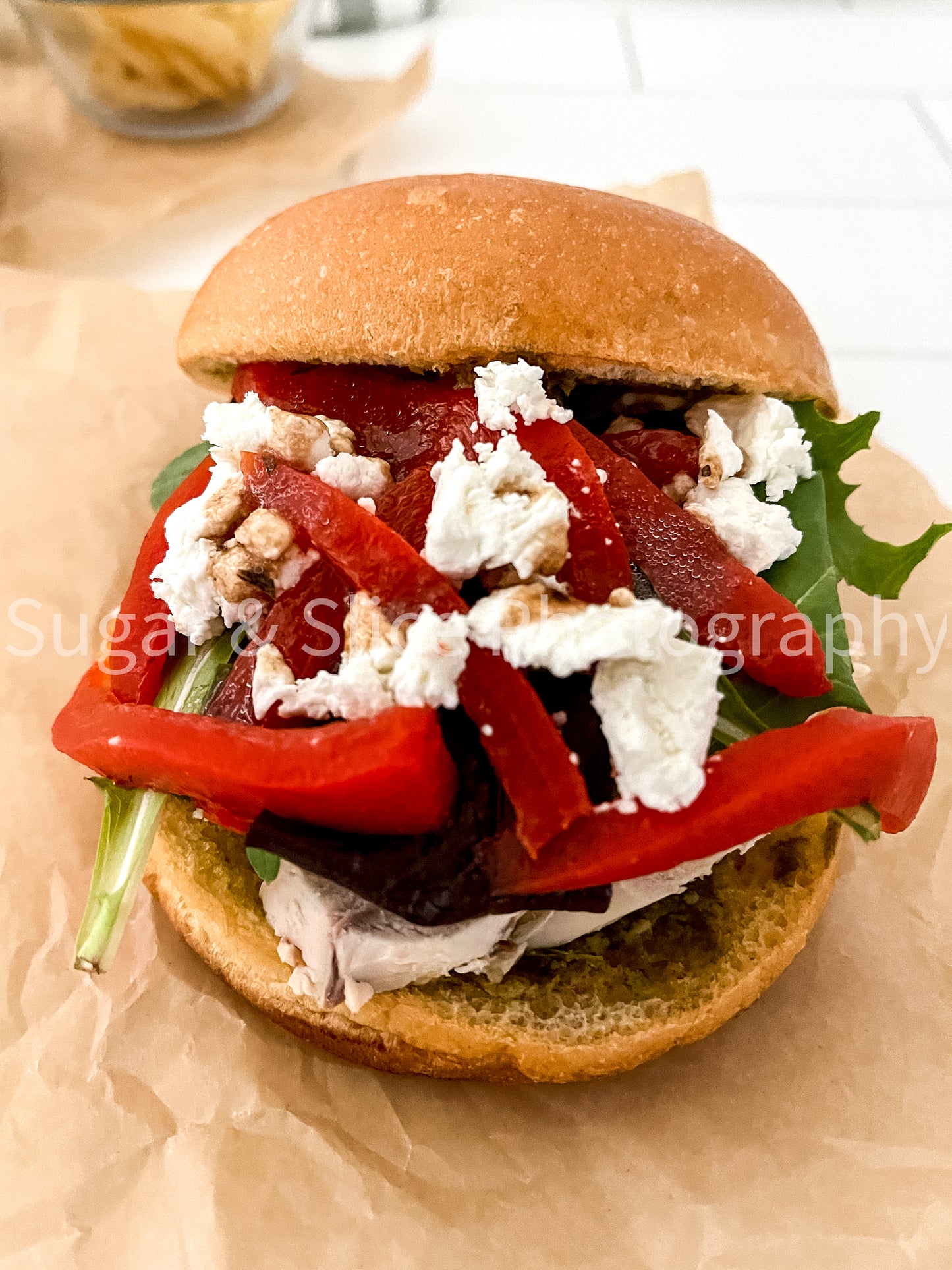Mediterranean Chicken Sandwich on White Ceramic Subway Tile