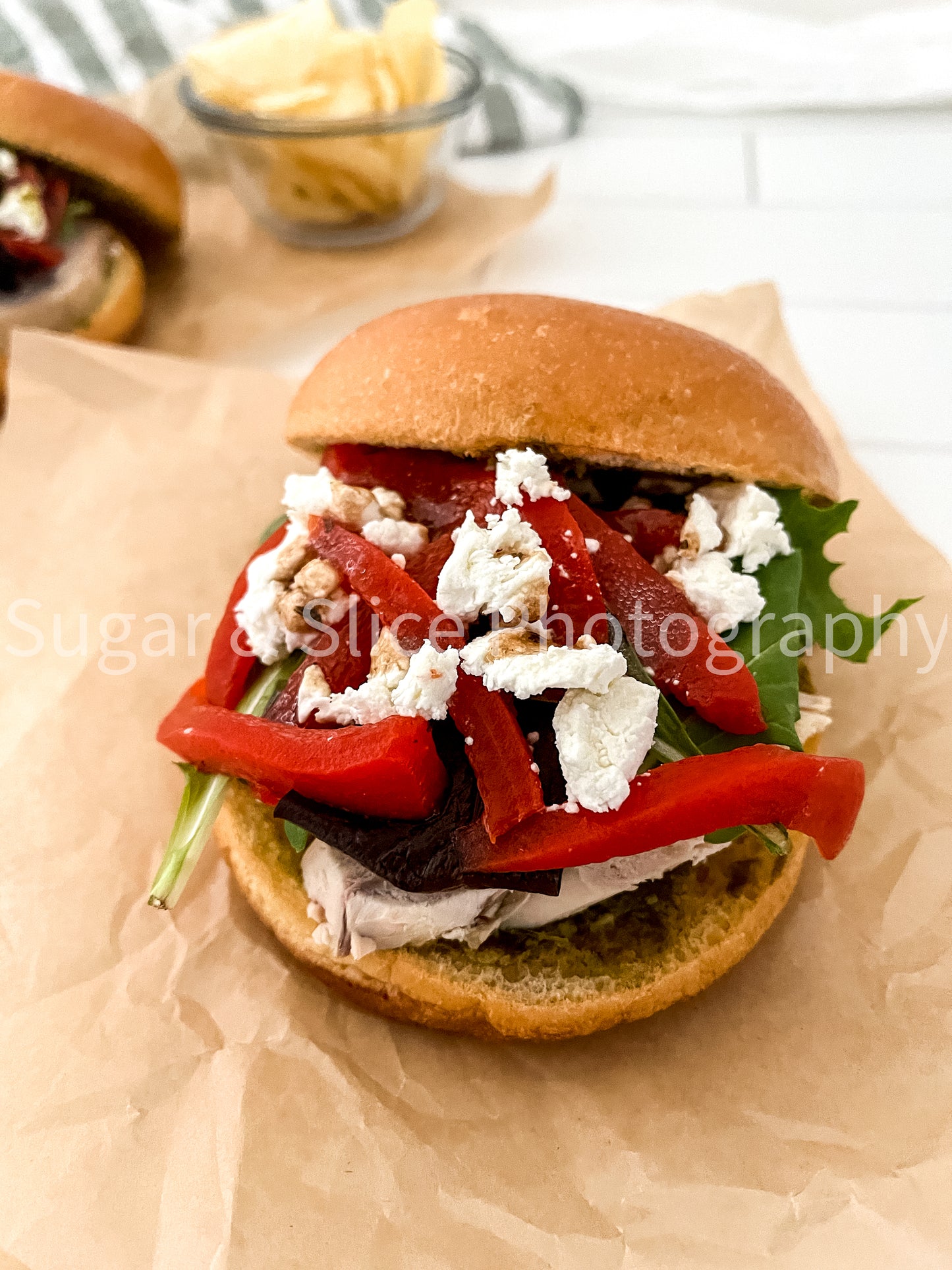Mediterranean Chicken Sandwich on White Ceramic Subway Tile