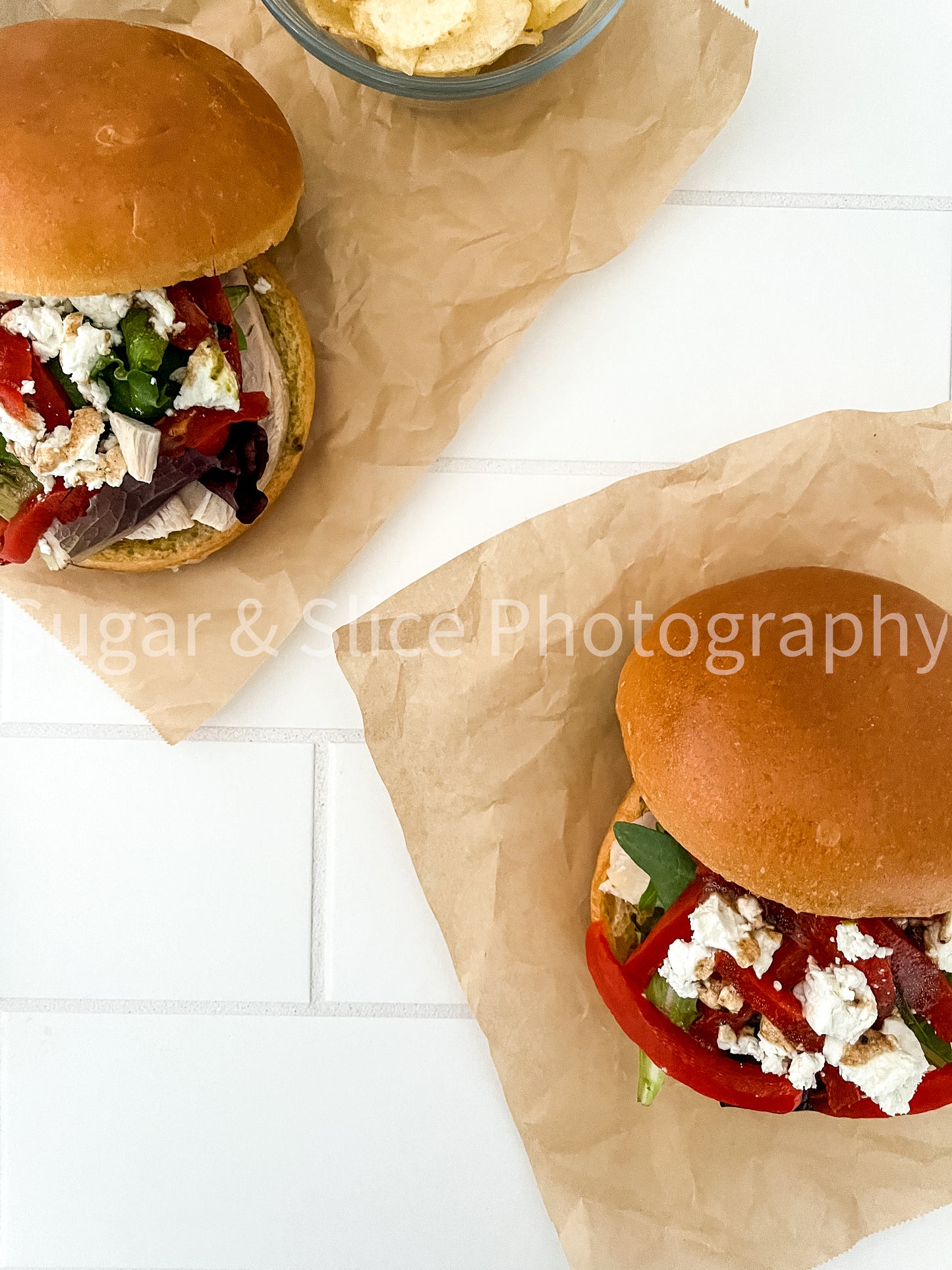 Mediterranean Chicken Sandwich on White Ceramic Subway Tile